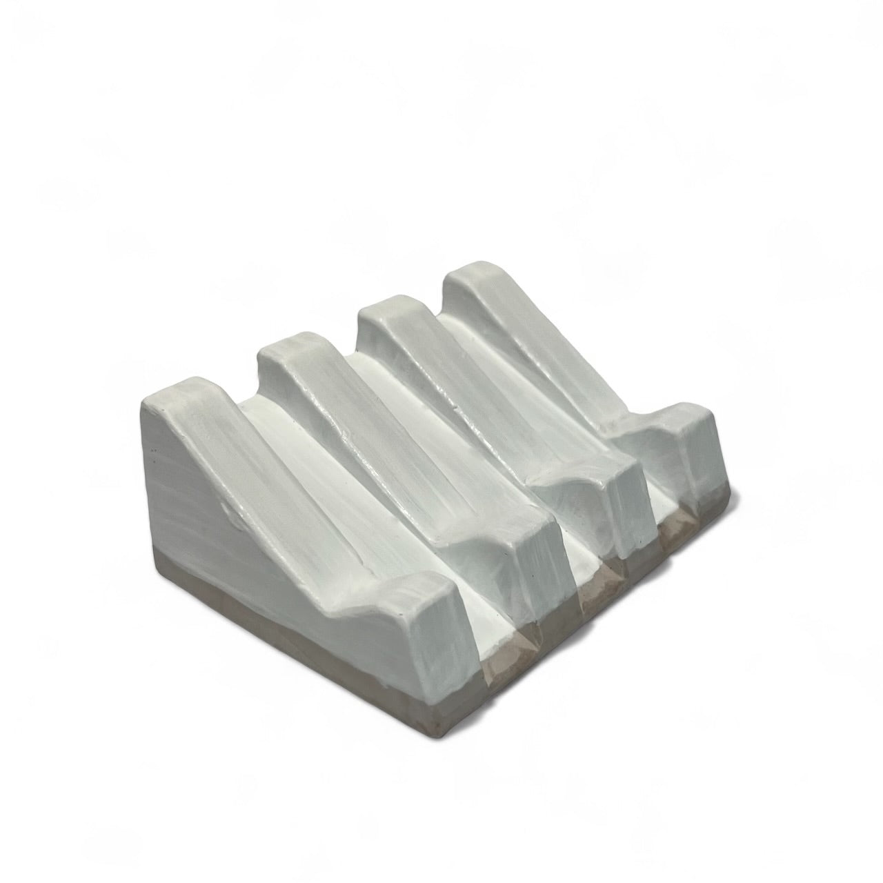 Organic-shaped soap dish with natural clay texture and rustic feel
