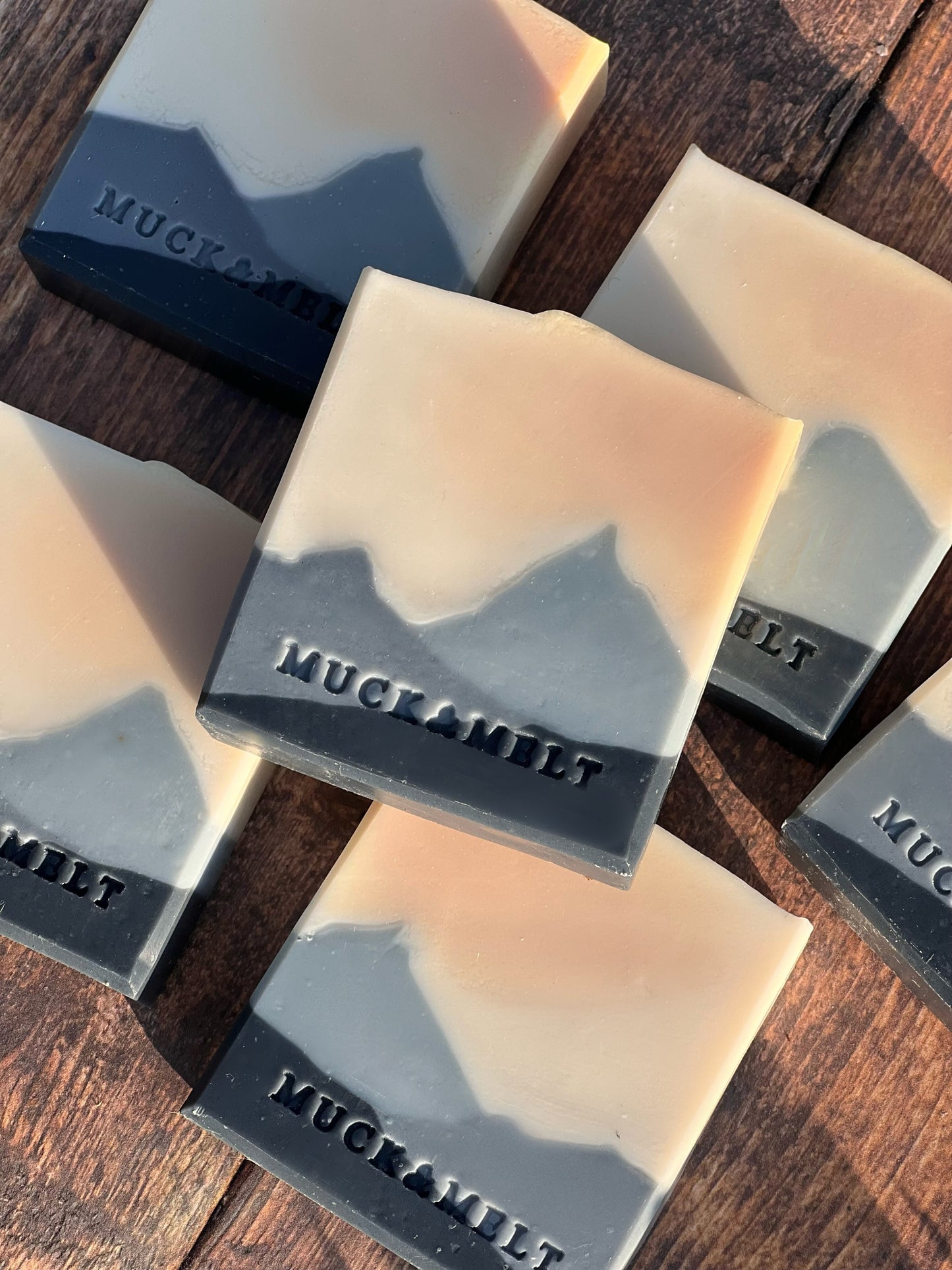 Handmade soap bar inspired by Welsh valley landscapes with grey mountain and peach sunset design