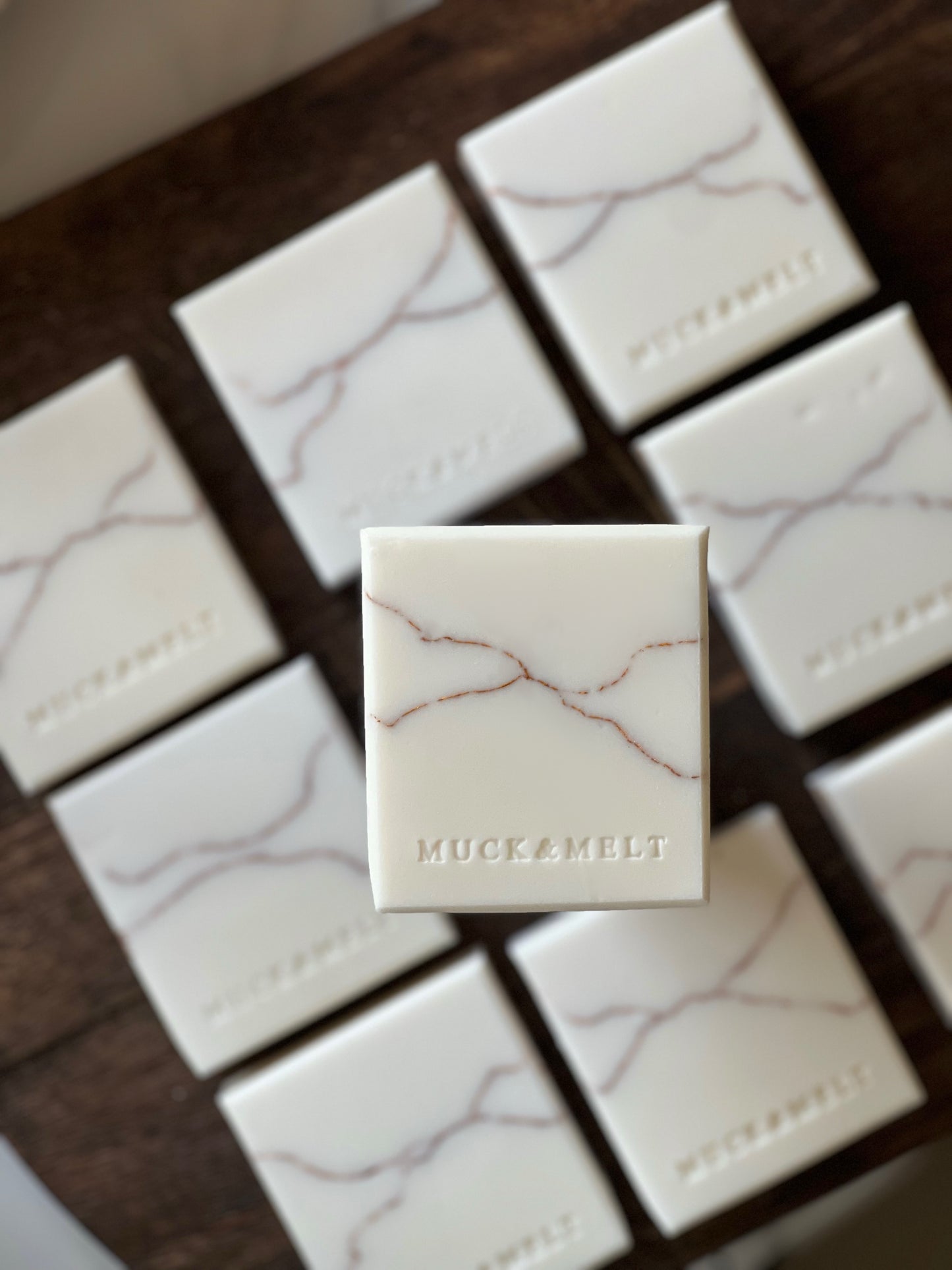 Natural white soap collection featuring gold-layered, marbling