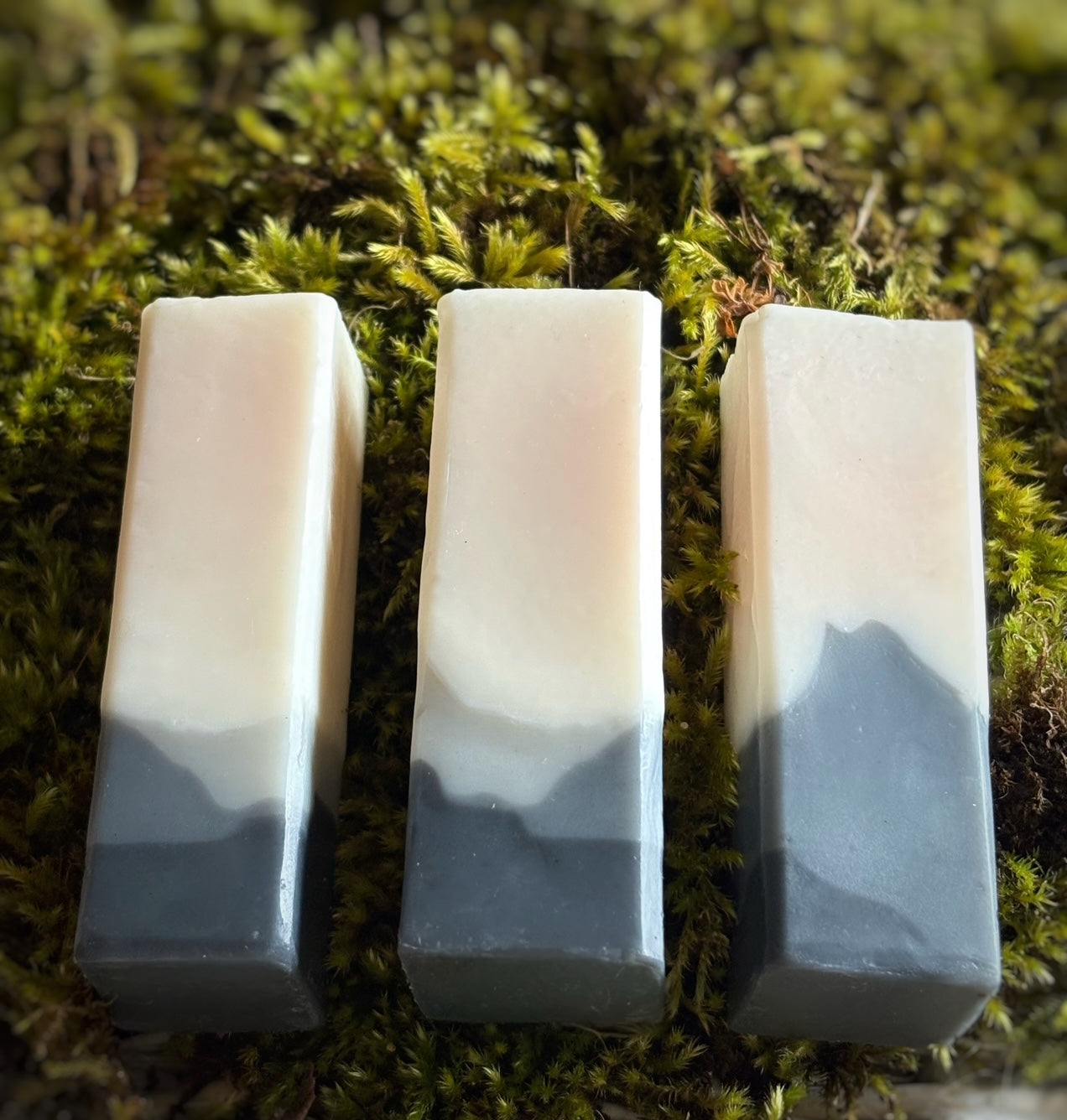 Close up of Mini Valley travel-sized handmade soap — mini natural soap bar perfect for sensitive skin with mountain design.