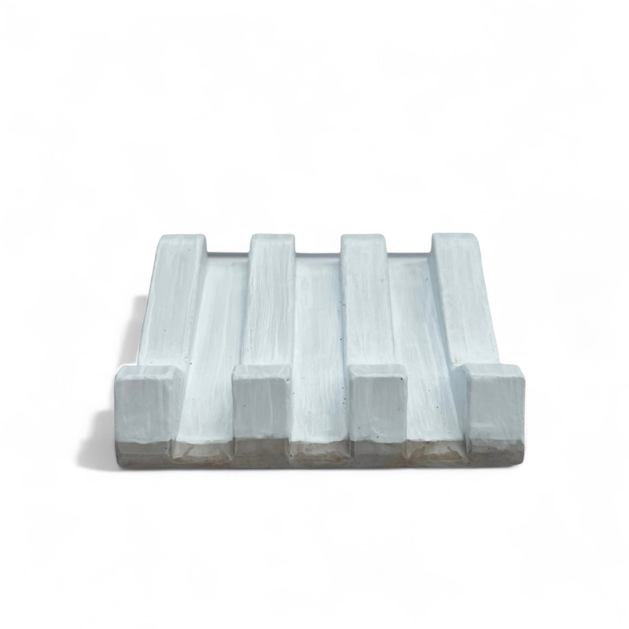 Organic-shaped soap dish front view with natural clay texture and rustic feel