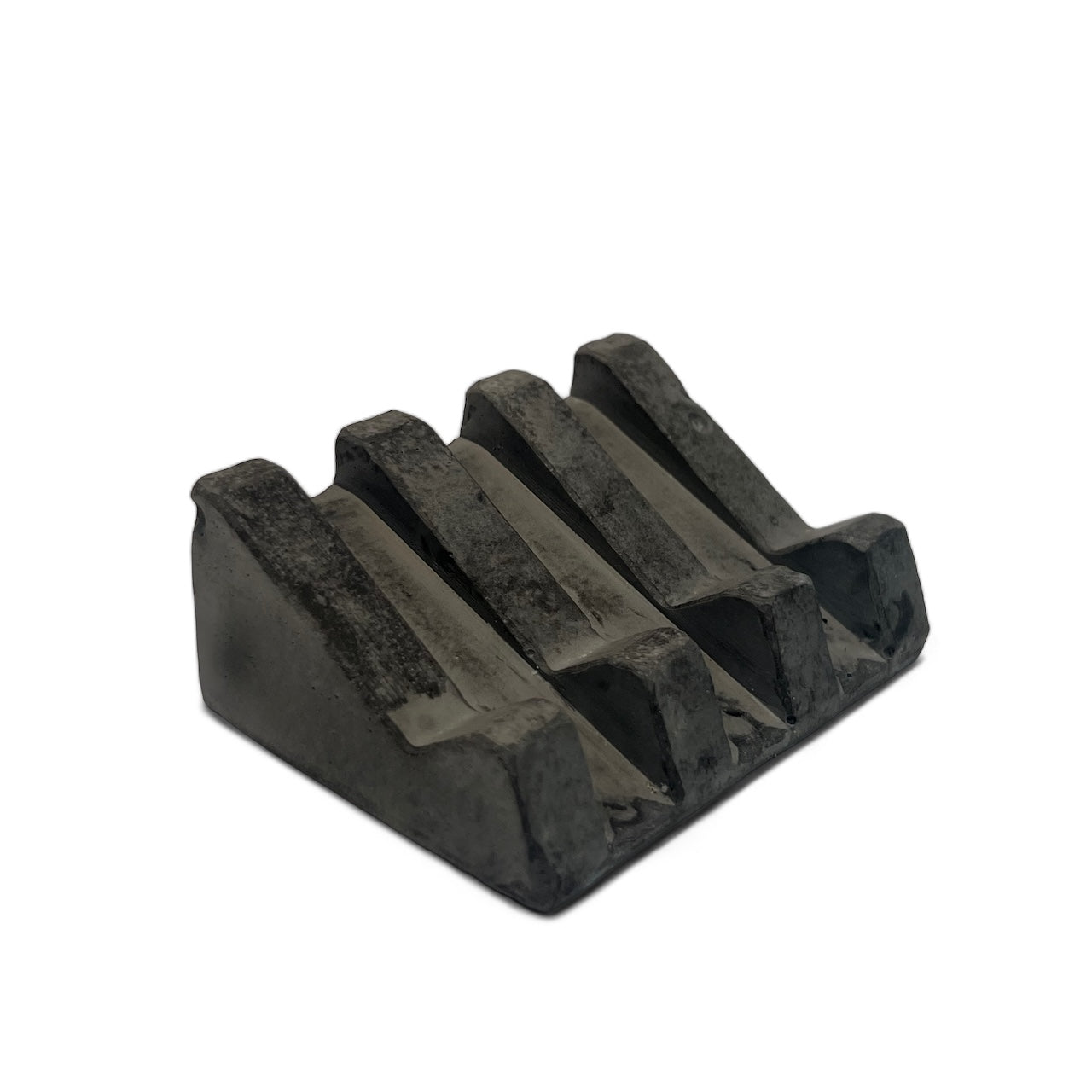 Black soap dish with slotted lines for drainage