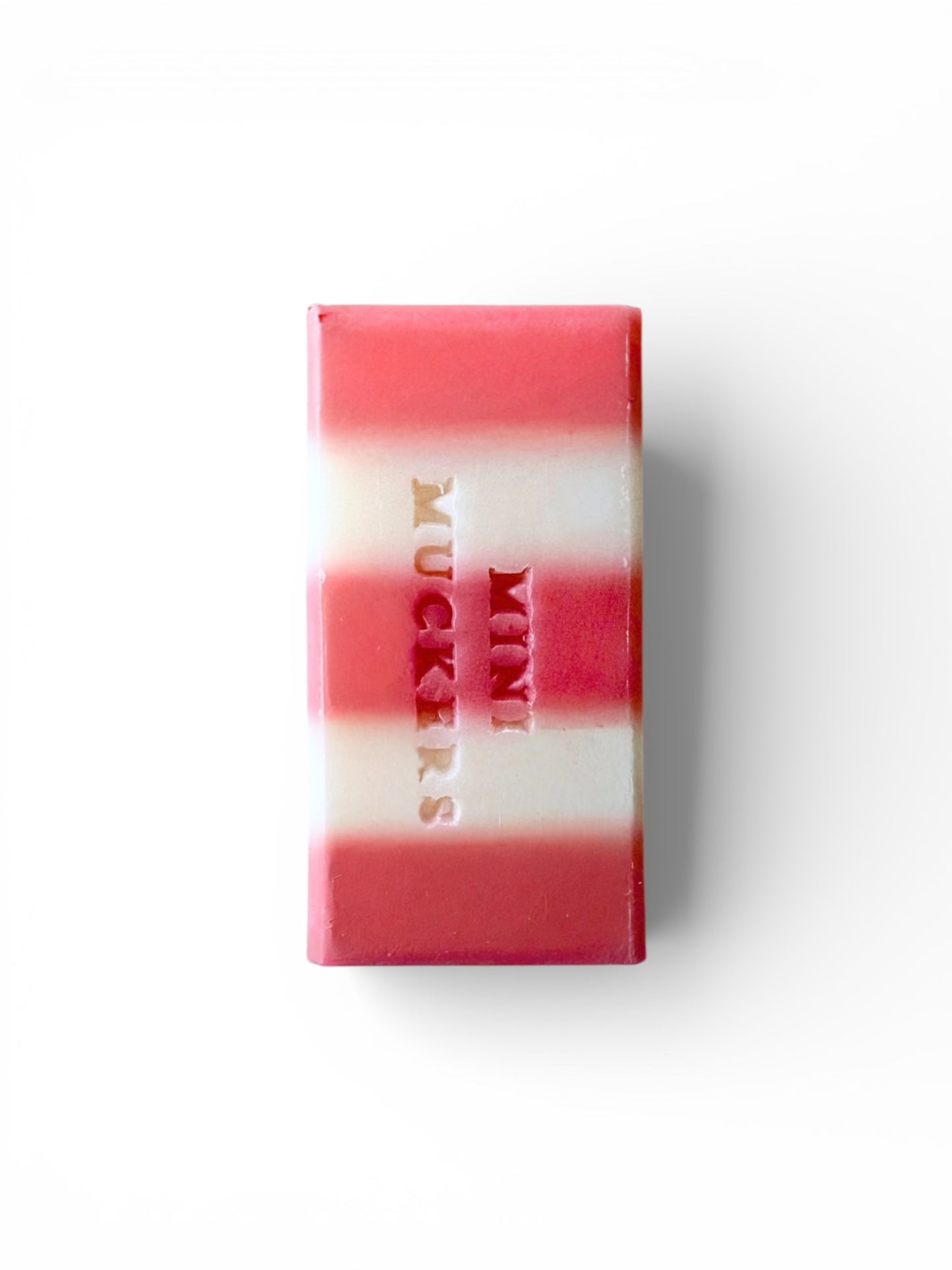 a 60g bar of pink and white stripy soap on a white background.