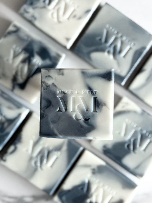 collection of Handmade, natural artisan soap with stone and marble inspired patterns in earthy tones