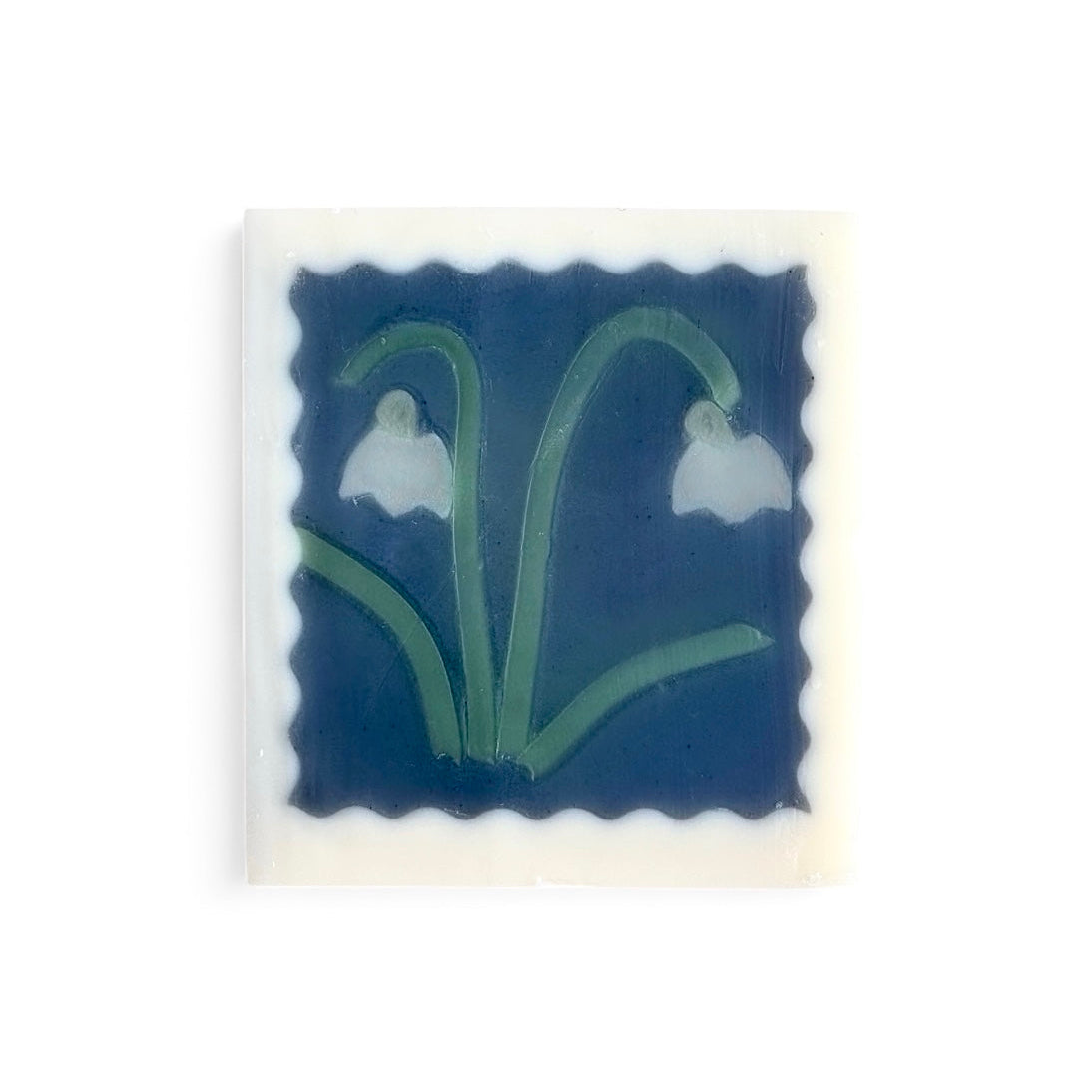 Gentle handmade soap featuring snowdrop flower motifs and soft botanical shades