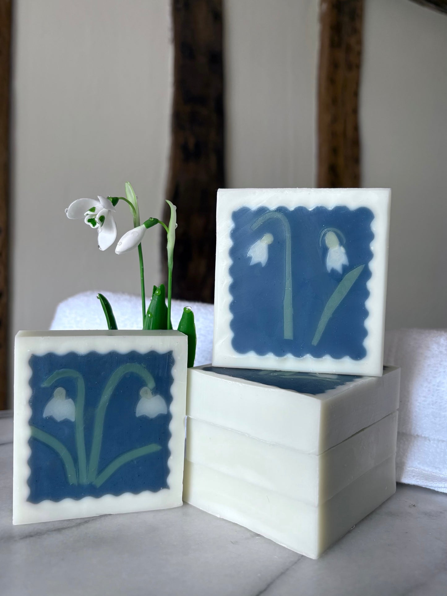handmade artisan soap featuring snowdrop design and snowdrops 