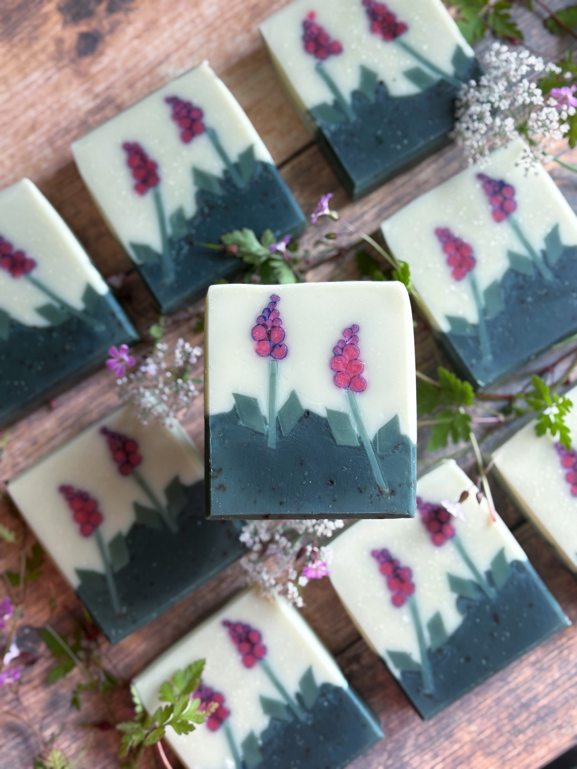 9 foxglove soaps on a table with woodland flowers
