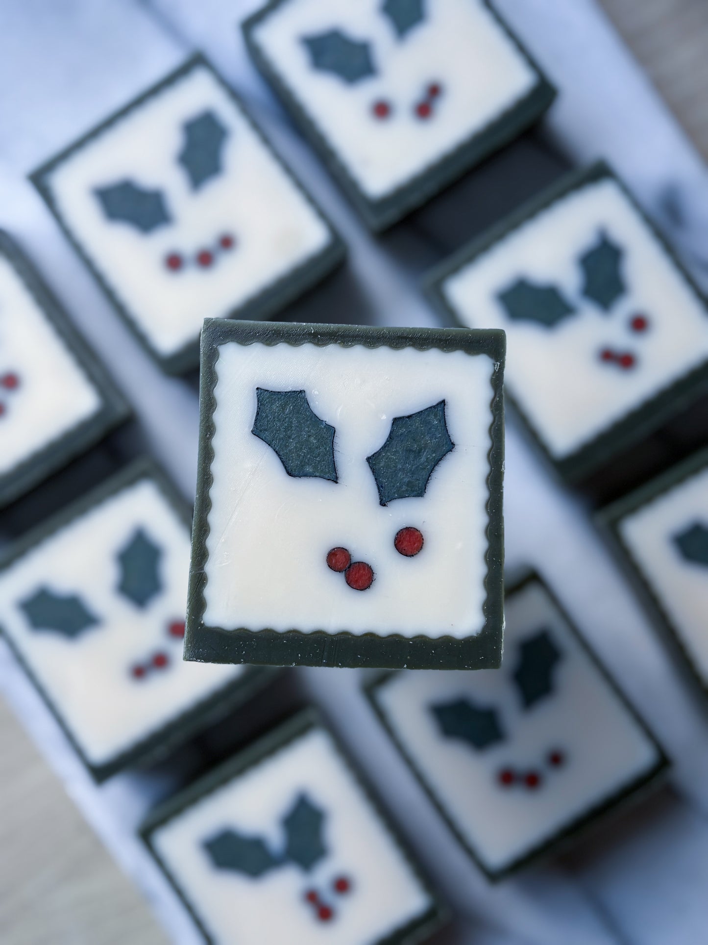 Plastic-free Christmas soap gift with holly illustration”