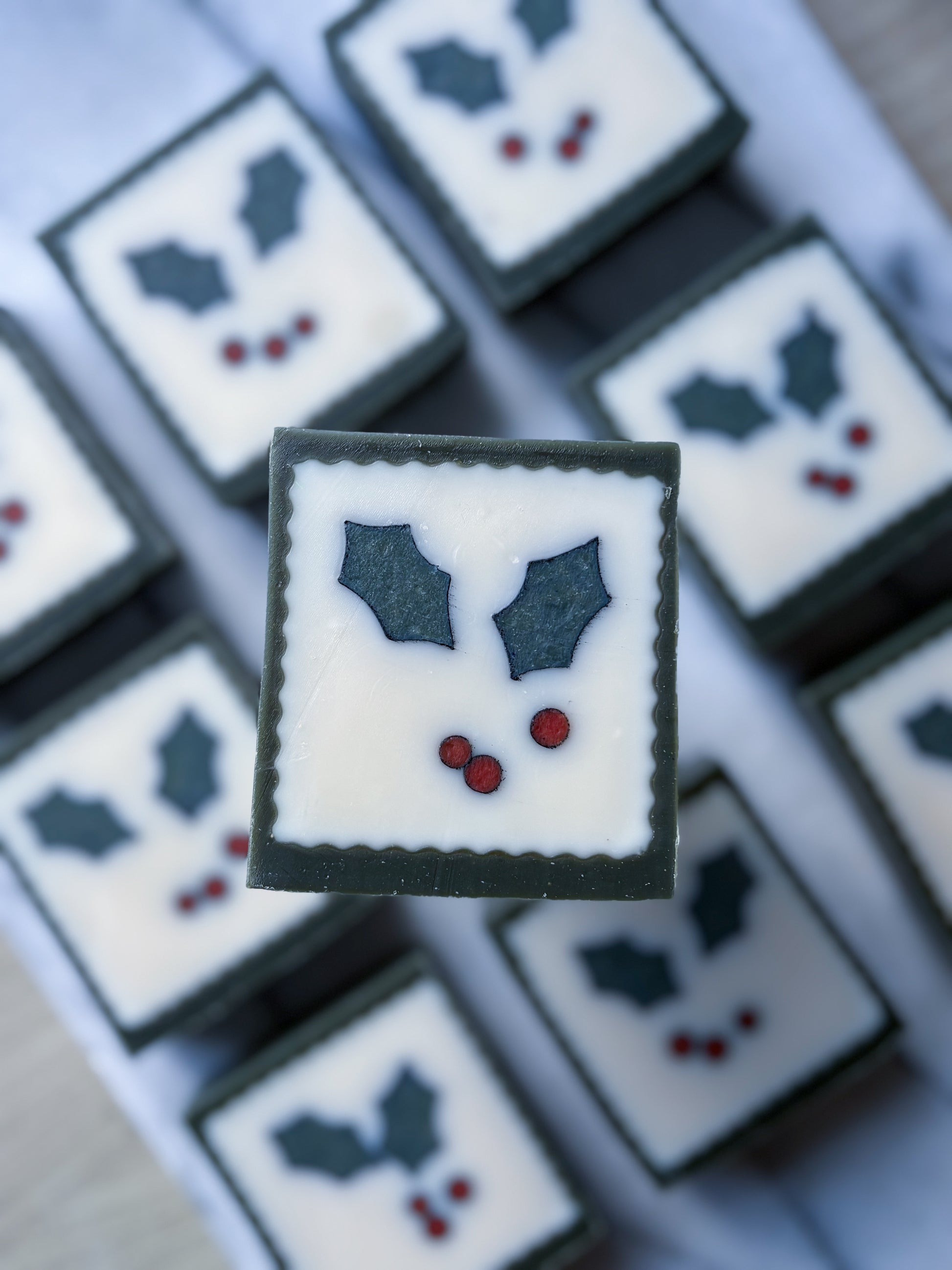 Plastic-free Christmas soap gift with holly illustration”