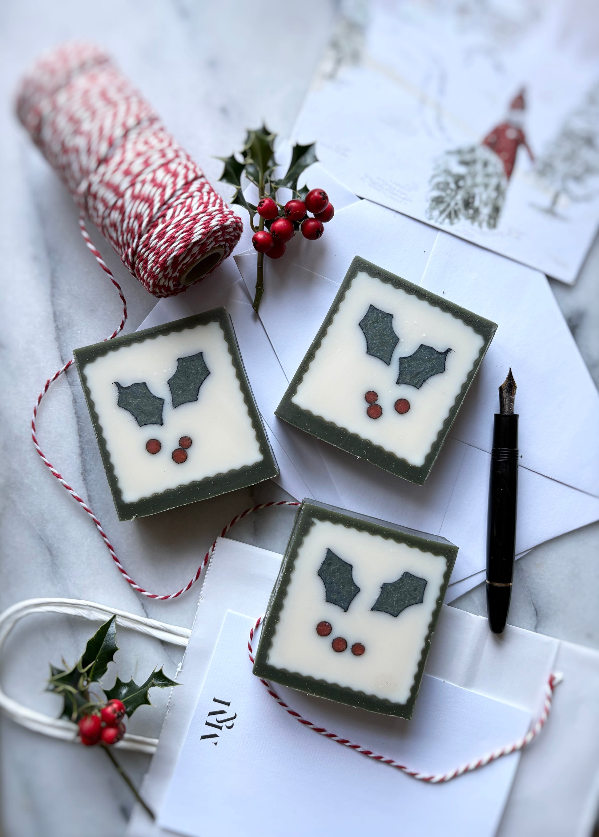 Handmade Holly Christmas soap with vintage 1950s postage stamp design”