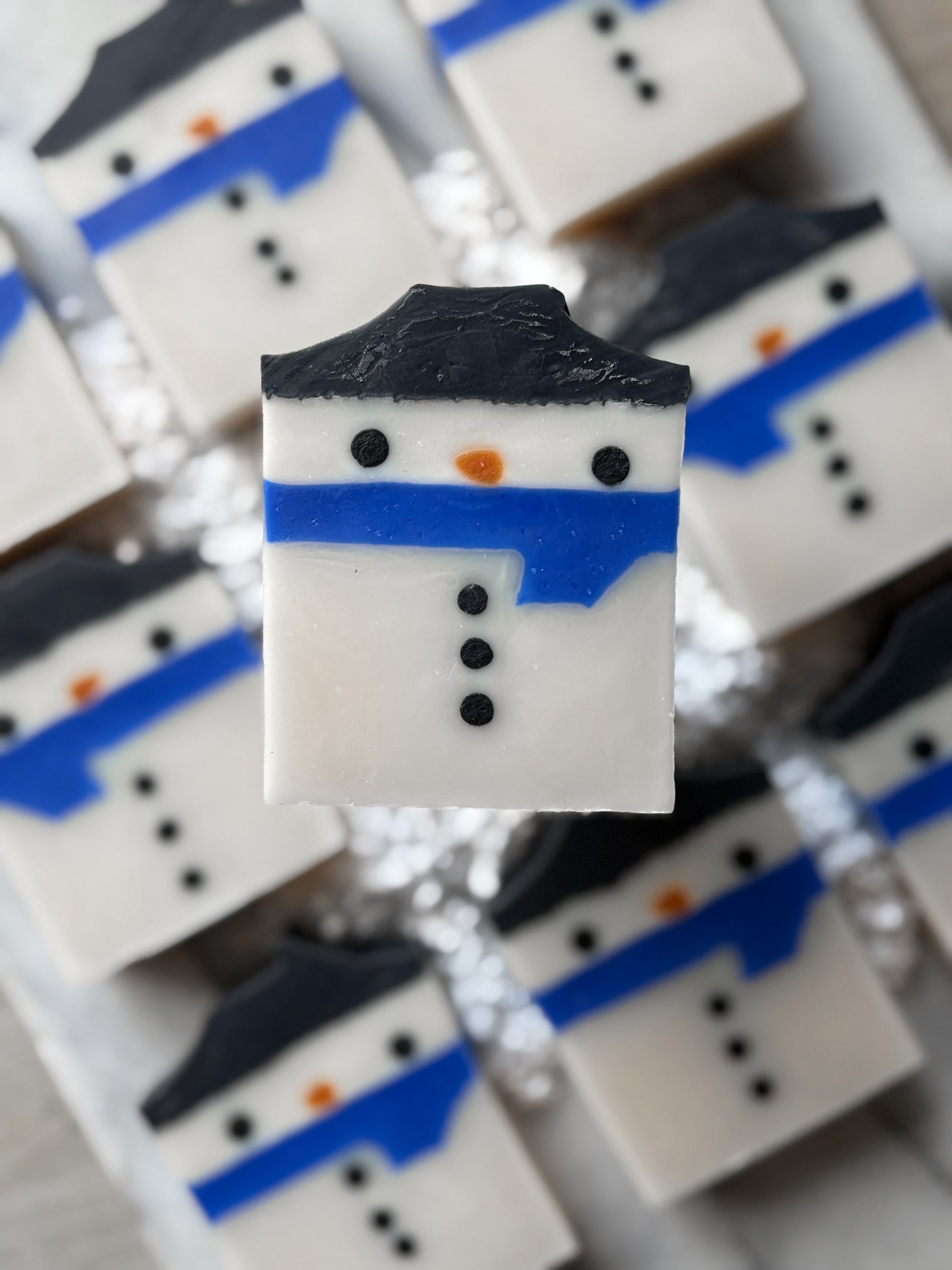 “Handmade Snowman Christmas soap with blue scarf”