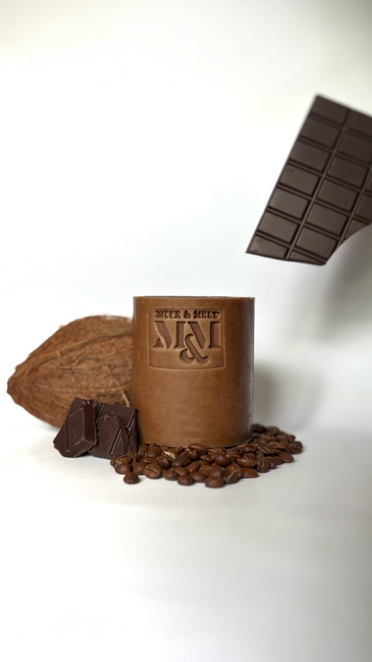 Brown handmade cocoa and coffee soap bar scented with sandalwood, frankincense and orange essential oils.